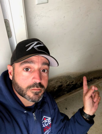 Frank pointing out mold damage